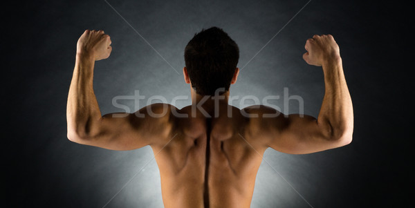 young male bodybuilder from back Stock photo © dolgachov