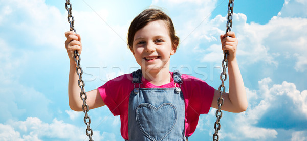Glücklich kleines Mädchen Swing blauer Himmel Sommer Kindheit Stock foto © dolgachov
