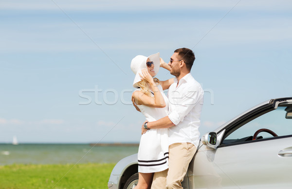 happy man and woman hugging near car at sea Stock photo © dolgachov
