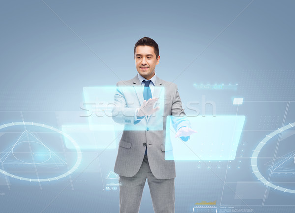 businessman in suit working with virtual screens Stock photo © dolgachov