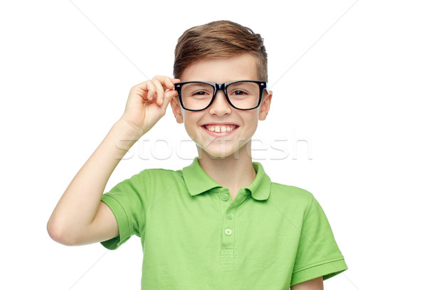 happy boy in green polo t-shirt and eyeglasses Stock photo © dolgachov