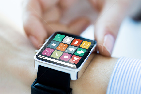 close up of hands setting smart watch application Stock photo © dolgachov