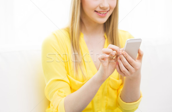 close up of woman texting on smartphone at home Stock photo © dolgachov