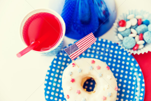 donut with juice and candies on independence day Stock photo © dolgachov