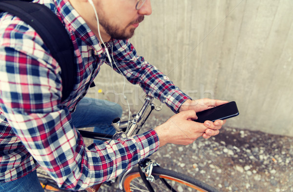 ヒップスター 男 イヤホン スマートフォン 自転車 人 ストックフォト © dolgachov