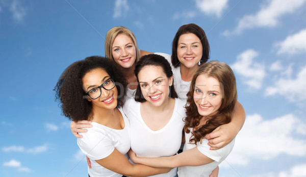 group of happy different women in white t-shirts Stock photo © dolgachov