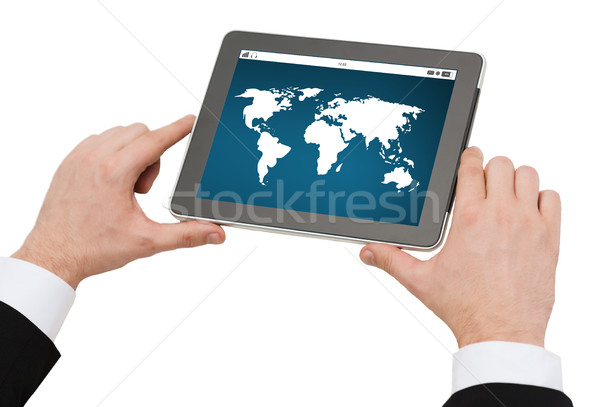 close up of hands holding tablet pc with world map Stock photo © dolgachov