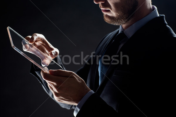 close up of businessman with transparent tablet pc Stock photo © dolgachov