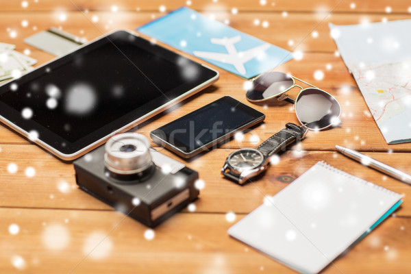 Stock photo: close up of smartphone and travel stuff