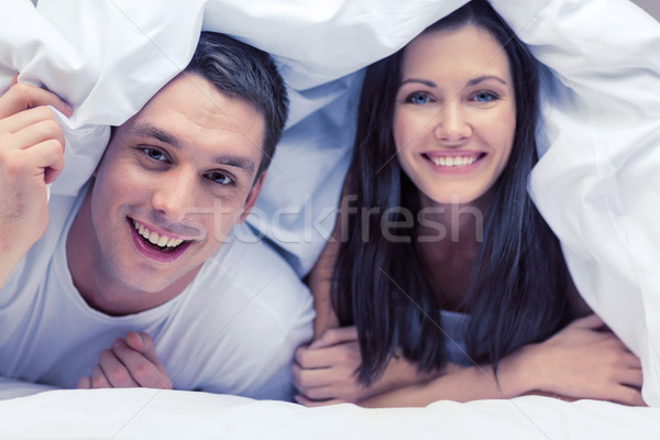 Boldog pár alszik ágy hotel utazás Stock fotó © dolgachov