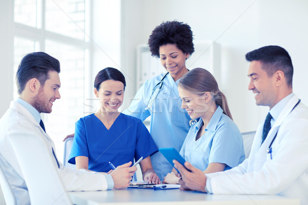 group of happy doctors meeting at hospital office Stock photo © dolgachov