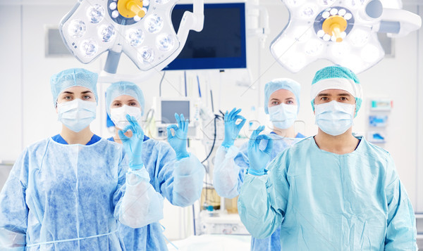 Stock photo: group of surgeons in operating room at hospital