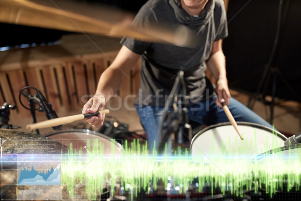 drummer playing drum kit at sound recording studio Stock photo © dolgachov