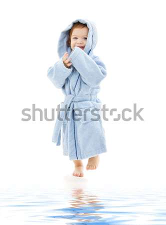 Copil băiat albastru halat alb apă Imagine de stoc © dolgachov