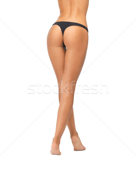 Vrouwelijke butt zwarte bikini slipje foto Stockfoto © dolgachov