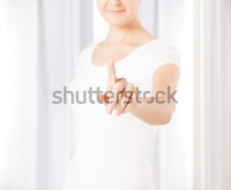 woman with finger up Stock photo © dolgachov