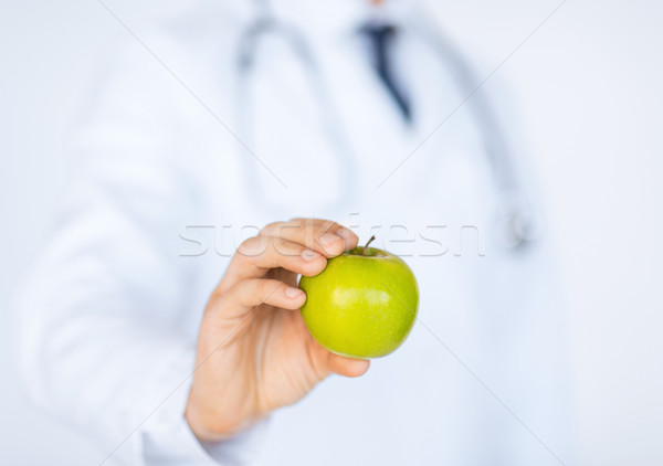 male doctor with green apple Stock photo © dolgachov