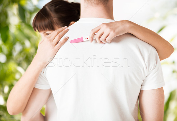 Nő terhességi teszt ölel férfi család gyereknevelés Stock fotó © dolgachov