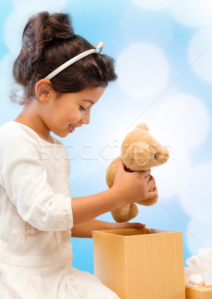 happy child girl with gift box and teddy bear Stock photo © dolgachov