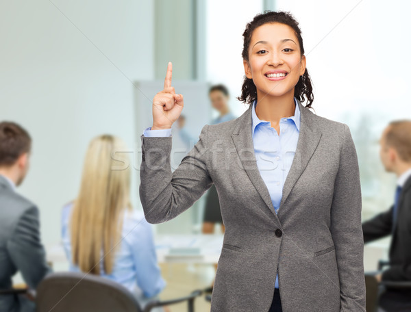 ストックフォト: 笑みを浮かべて · 女性実業家 · 指 · アップ · オフィス · ビジネス