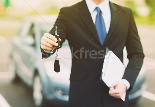 Stock photo: man with car key outside