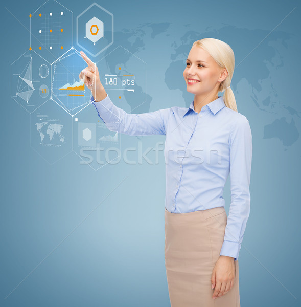 smiling businesswoman working with virtual screen Stock photo © dolgachov