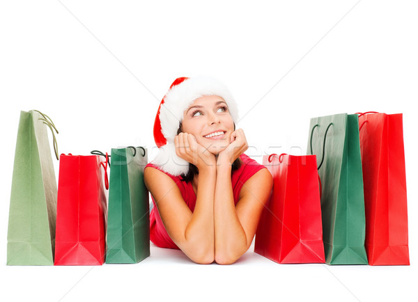 woman in red shirt with shopping bags Stock photo © dolgachov