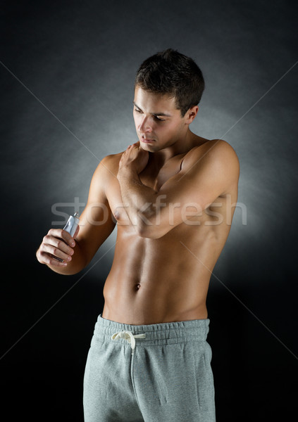 Jungen männlich Bodybuilder Schmerzen Erleichterung Stock foto © dolgachov