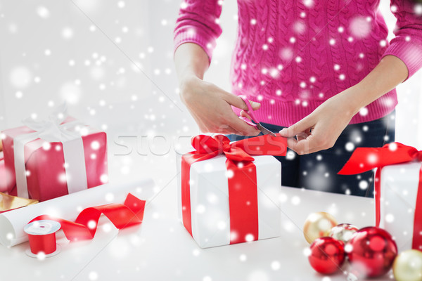 close up of woman decorating christmas presents Stock photo © dolgachov