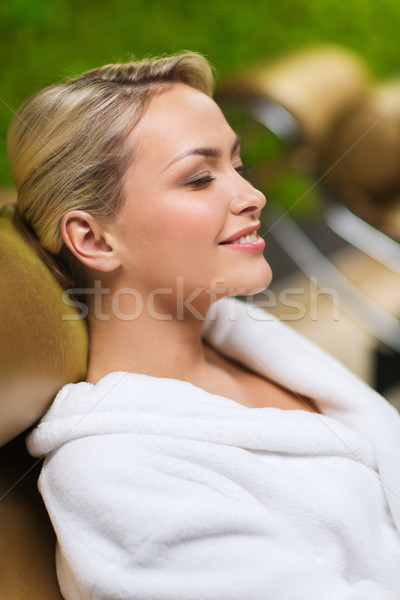 Stock photo: close up of woman sitting in bath robe at spa