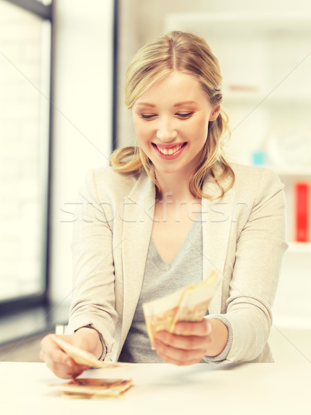 lovely woman counting euro cash money Stock photo © dolgachov