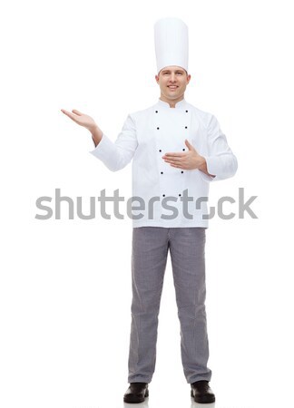 happy male chef cook inviting Stock photo © dolgachov