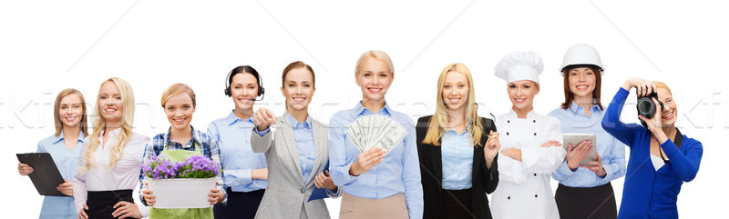 woman holding money over professional workers Stock photo © dolgachov