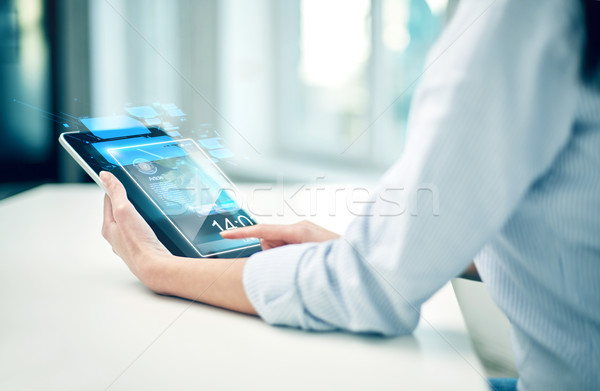close up of woman hands with tablet pc at office Stock photo © dolgachov