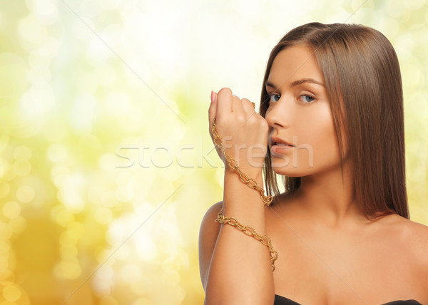 Mujer dorado collar amarillo luces Foto stock © dolgachov