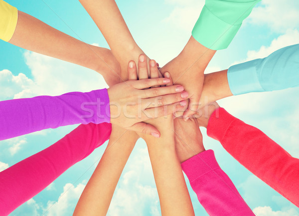 close up of women hands on top in rainbow clothes Stock photo © dolgachov