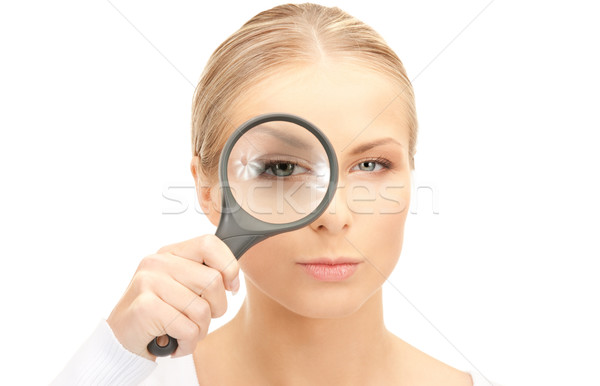 Stock photo: woman with magnifying glass