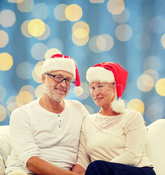 happy senior couple in santa helper hats Stock photo © dolgachov