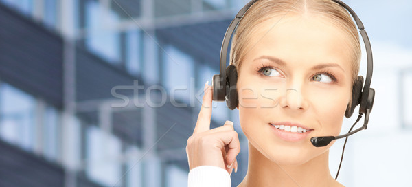helpline operator in headset over business center Stock photo © dolgachov
