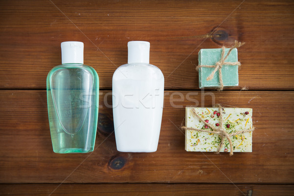 close up of handmade soap bars and lotions on wood Stock photo © dolgachov