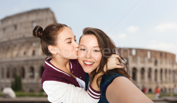 happy teenage girls taking selfie over coliseum Stock photo © dolgachov