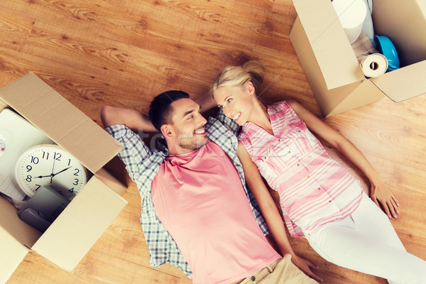 couple with big cardboard boxes moving to new home Stock photo © dolgachov