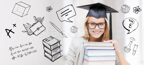 happy student woman in mortarboard with books Stock photo © dolgachov