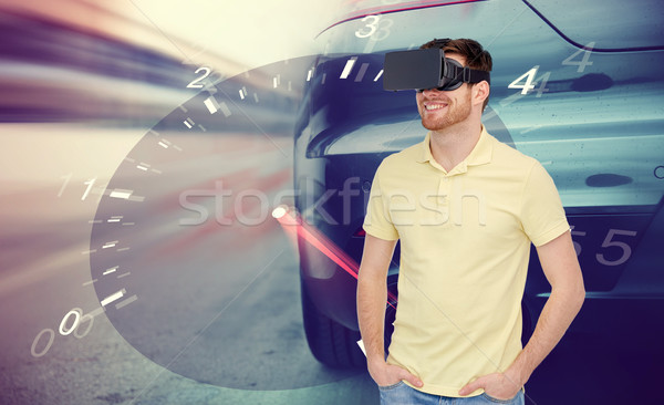 man in virtual reality headset and car racing game Stock photo © dolgachov