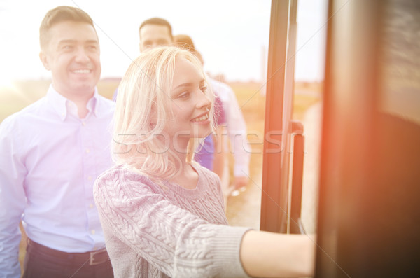 group of happy passengers boarding travel bus Stock photo © dolgachov