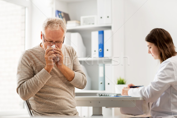 senior man and doctor meeting at hospital Stock photo © dolgachov