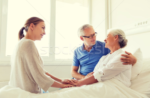 happy family visiting senior woman at hospital Stock photo © dolgachov