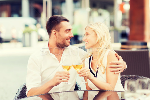 happy couple clinking glasses at restaurant lounge Stock photo © dolgachov