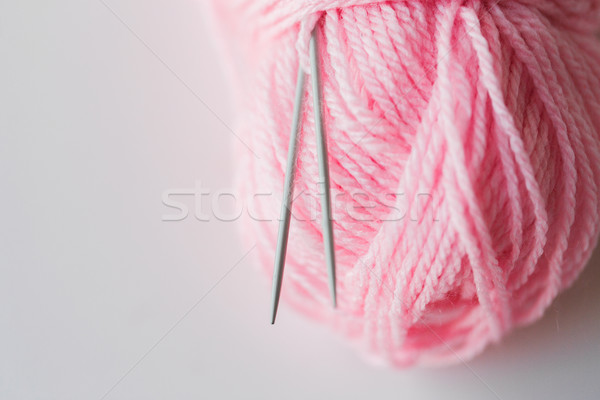 close up of knitting needles and pink yarn ball  Stock photo © dolgachov