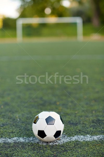 soccer ball on football field marking line Stock photo © dolgachov